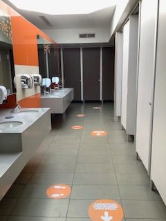 Toilet flooring with safety stickers.